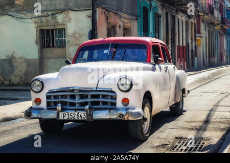 Street Scene with white and red Vintage Classic American Car, Havana, Cuba Stock Photo