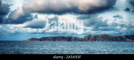 Landscape of the Arctic Ocean. Horizontal panorama of the sea with a view of the cliffs.
