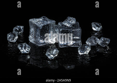 ice cubes on black isolated glass background Stock Photo