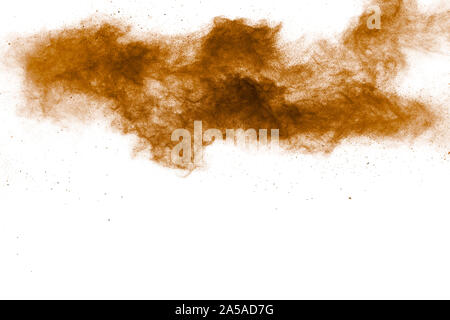 Abstract deep brown dust explosion on white background.Freeze motion of brown dust splash. Stock Photo