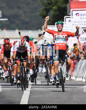 (191019) -- NANNING, Oct. 19, 2019 (Xinhua) -- German Pascal Ackermann (1st R) of Bora-Hansgrohe celebrates after crossing the finish line during the stage three circuit race at the 2019 UCI World Tour/Tour of Guangxi in Nanning, capital of south China's Guangxi Zhuang Autonomous Region, Oct. 19, 2019. (Xinhua/Cao Yiming) Stock Photo