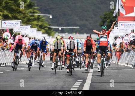 (191019) -- NANNING, Oct. 19, 2019 (Xinhua) -- German Pascal Ackermann (1st R) of Bora-Hansgrohe celebrates after crossing the finish line during the stage three circuit race at the 2019 UCI World Tour/Tour of Guangxi in Nanning, capital of south China's Guangxi Zhuang Autonomous Region, Oct. 19, 2019. (Xinhua/Cao Yiming) Stock Photo