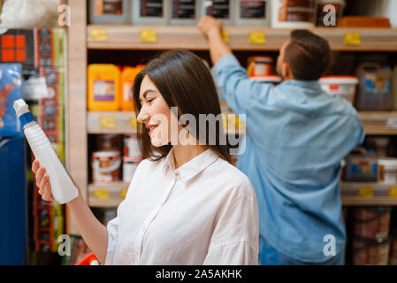 Happy buyers choosing materials in hardware store Stock Photo