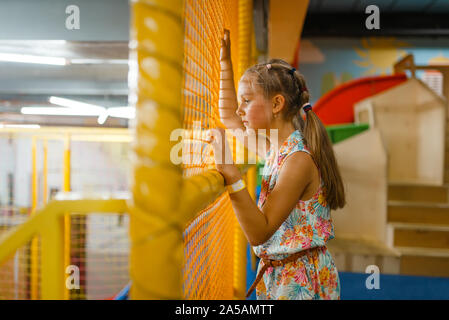 Adorable little girl playing in kids labyrinth Stock Photo