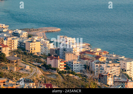 Sunset elevated view taken in the golden hour of a calm spring evening, Saranda, Albania, residential quarter Stock Photo