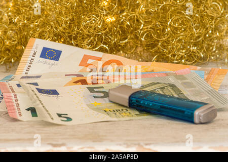 Data memory with banknotes against a Christmassy golden warm background Stock Photo