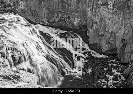 Waterfall in canyon, black and white. Stock Photo