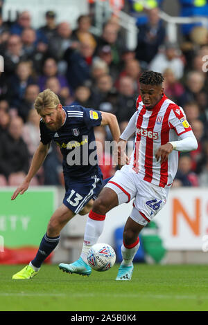 Stoke On Trent, UK. 19th Oct, 2019. Stoke City forward Tyrese Campbell (26) turns away from Fulham defender Tim Ream (13) and goes on to score the opening goal for Stoke City during the EFL Sky Bet Championship match between Stoke City and Fulham at the bet365 Stadium, Stoke-on-Trent, England on 19 October 2019. Photo by Jurek Biegus. Editorial use only, license required for commercial use. No use in betting, games or a single club/league/player publications. Credit: UK Sports Pics Ltd/Alamy Live News Stock Photo