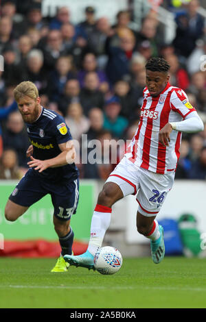 Stoke On Trent, UK. 19th Oct, 2019. Stoke City forward Tyrese Campbell (26) turns away from Fulham defender Tim Ream (13) and goes on to score the opening goal for Stoke City during the EFL Sky Bet Championship match between Stoke City and Fulham at the bet365 Stadium, Stoke-on-Trent, England on 19 October 2019. Photo by Jurek Biegus. Editorial use only, license required for commercial use. No use in betting, games or a single club/league/player publications. Credit: UK Sports Pics Ltd/Alamy Live News Stock Photo