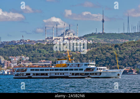 ISTANBUL TURKEY USKUDAR SKYLINE WITH THE LARGE WHITE CAMLICA MOSQUE AND PASSENGER BOAT ON THE BOSPHORUS Stock Photo