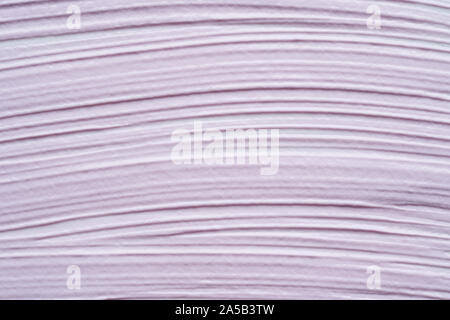Gently purple texture and strokes of a facial cleansing mask or acrylic paint isolated on a white background Stock Photo