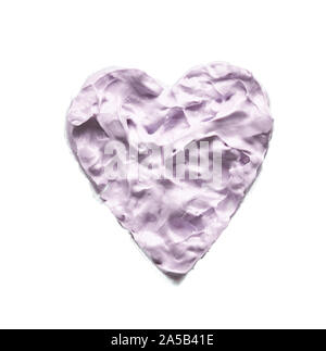 Gently purple texture and strokes of a facial cleansing mask or acrylic paint isolated on a white background Stock Photo