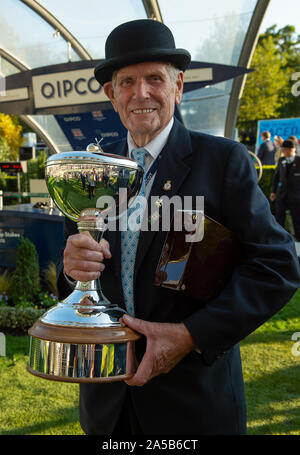 QIPCO British Champions Day, Ascot Racecourse, Ascot, Berkshire, UK. 19th October, 2019. Steward George Ridgley retires from Ascot today after 29 years. Here he holds the Champion Flat Owner's trophy following the presentation. Credit: Maureen McLean/Alamy Live News Stock Photo