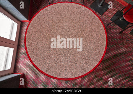 Round textured restaurant table view from above. Stock Photo
