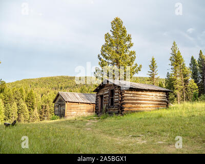 Abandoned log buildings in western ghost town. Stock Photo
