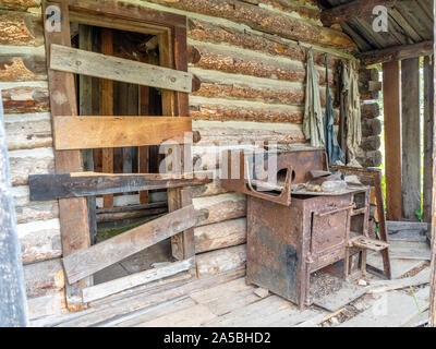 Abandoned log buildings in western ghost town. Stock Photo
