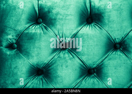Furniture design, classic interior and royal vintage material concept - Emerald luxury velour quilted sofa upholstery with buttons, elegant green home Stock Photo