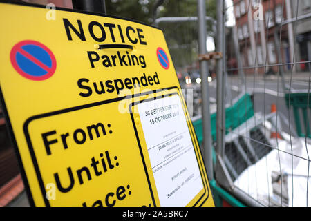 notice warning of car parking suspension in the london borough known as