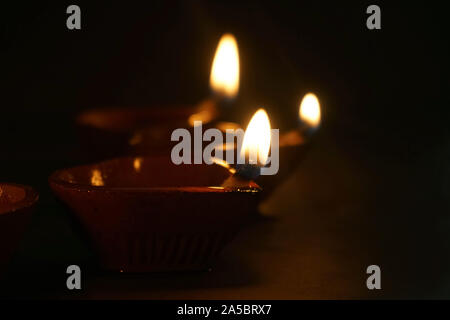 Diwali festival lamp on wooden background Stock Photo