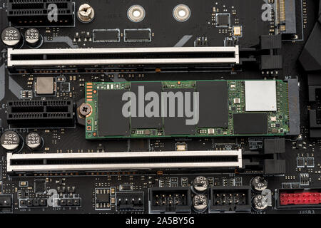 A NVMe solid state drive installed on a motherboard Stock Photo