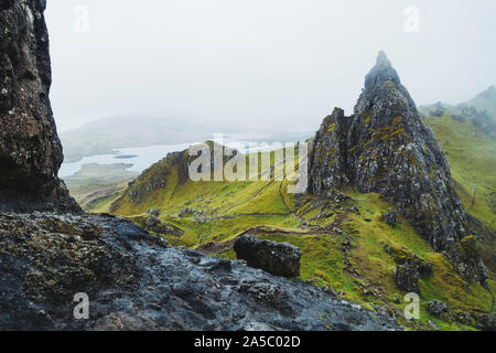 A grey, rainy, cloudy day at the Old Man of Storr, a famous rock formation on the Isle of Skye, Scotland Stock Photo