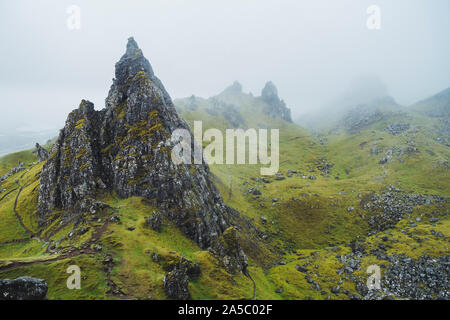 A grey, rainy, cloudy day at the Old Man of Storr, a famous rock formation on the Isle of Skye, Scotland Stock Photo