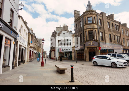 Crown Bar and De Villa's restaurant, on a quiet street in the town of Wick, in the far north of the United Kingdom Stock Photo