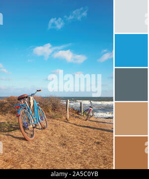 Color matching complementary palette from travel image of bikes by the entrance to the beach on island Hiddensee on the German coast of Baltic Sea. Na Stock Photo