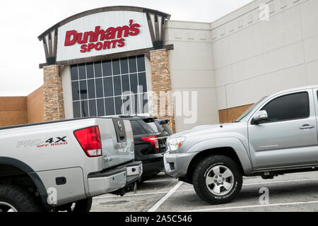 A logo sign outside of a Dunham's Sports retail store in Danville, Virginia on September 15, 2019. Stock Photo