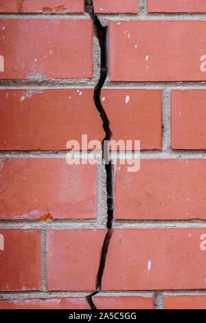 crack in the brick wall, signs of deformation of the building Stock Photo