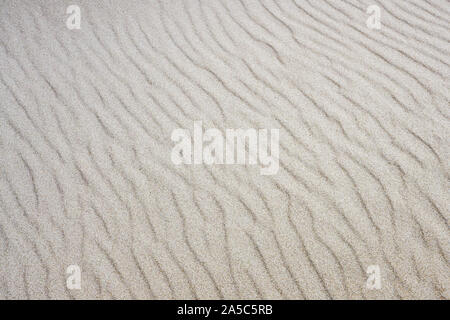 Result of wind game with sand at seashore Stock Photo
