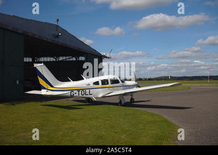 Light aircraft parked near hanger. Wolverhampton Halfpenny Green Airport. South Staffordshire. UK Stock Photo