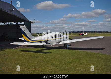 Light aircraft parked near hanger. Wolverhampton Halfpenny Green Airport. South Staffordshire. UK Stock Photo