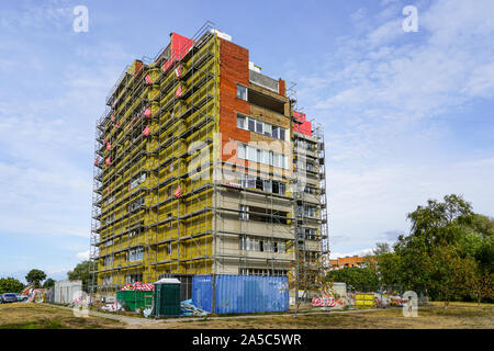 scaffolding arround the house to install thermal insulation of the apartment building facade Stock Photo