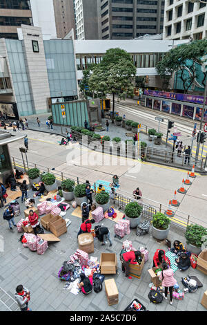 Filipino domestic workers gather on their day-off and prepare shipments to send back home to the Philippines in Central District, Hong Kong. Approximately 130,000 Filipino domestic servants work in Hong Kong and all have Sundays off. Stock Photo