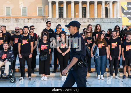 A police officer passes in front of the participants standing at the Greek Parliament during the parade.Walk for Freedom is a global response to human trafficking. It’s an awareness and fundraising event rallying thousands of abolitionists, taking millions of steps in hundreds of cities all over the world.