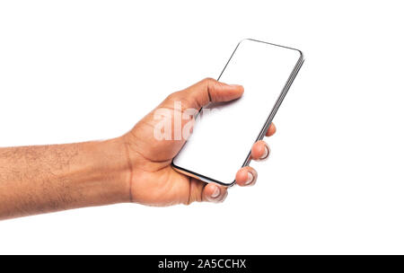 Modern frameless smartphone with blank screen in afro man's hand Stock Photo