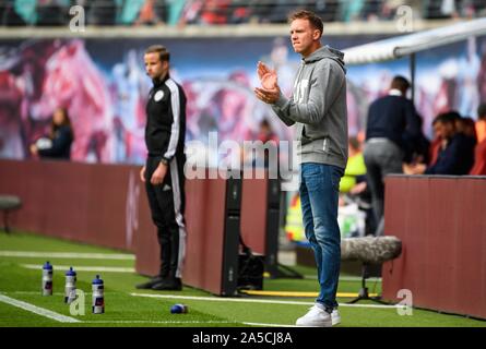 Leipzig, Germany. 19th Oct, 2019. Head coach Julian Nagelsmann (R) of Leipzig reacts during a 2019-2020 season German Bundesliga match between RB Leipzig and VfL Wolfsburg in Leipzig, Germany, Oct. 19, 2019. Credit: Kevin Voigt/Xinhua/Alamy Live News Stock Photo
