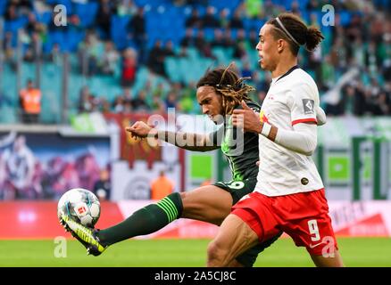 Leipzig, Germany. 19th Oct, 2019. Kevin Mbabu (L) of Wolfsburg vies with Yussuf Poulsen of Leipzig during a 2019-2020 season German Bundesliga match between RB Leipzig and VfL Wolfsburg in Leipzig, Germany, Oct. 19, 2019. Credit: Kevin Voigt/Xinhua/Alamy Live News Stock Photo