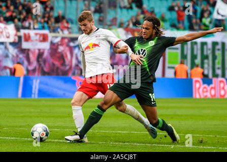 Leipzig, Germany. 19th Oct, 2019. Timo Werner (L) of Leipzig vies with Kevin Mbabu of Wolfsburg during a 2019-2020 season German Bundesliga match between RB Leipzig and VfL Wolfsburg in Leipzig, Germany, Oct. 19, 2019. Credit: Kevin Voigt/Xinhua/Alamy Live News Stock Photo