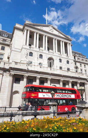 Red London bus passing the Bank of England, Threadneedle Street, City of London, Financial District, England, UK