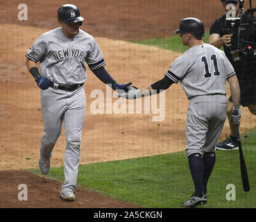 Houston, United States. 19th Oct, 2019. New York Yankees Gio Urshela (L) celebrates solo home run with teammate Brett Gardner (11) against the Houston Astros in the fourth inning in Game 6 of the American League Championship Series at Minute Maid Park in Houston, Texas on Sunday, October 19, 2019. The Astros with a win over the Yankees move on to the 2019 World Series against the Washington Nationals. Photo by Trask Smith/UPI Credit: UPI/Alamy Live News Stock Photo