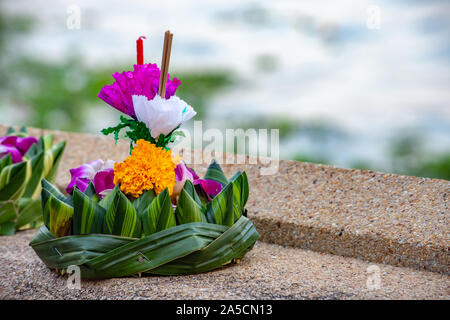decorated float made from natural materials that is going to drop down the river. Stock Photo