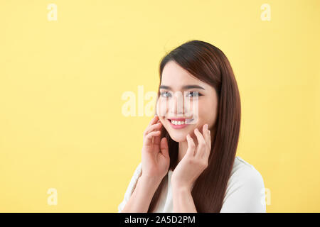 Beautiful young woman with clean fresh skin .Girl beauty face care. Facial treatment Stock Photo