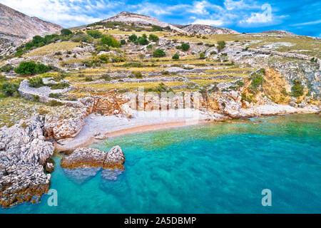Island of Krk idyllic pebble beach with karst landscape, stone deserts of Stara Baska, Kvarner bay of Croatia Stock Photo