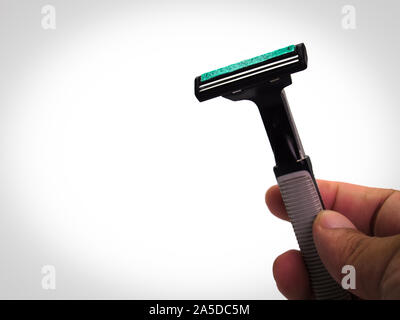 Shaving razor on a white background. Stock Photo
