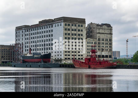 London, England - May 16, 2018: This is the derelict Millennium Mills on the banks of the Thames river on the south side of the Royal Victoria Docks Stock Photo