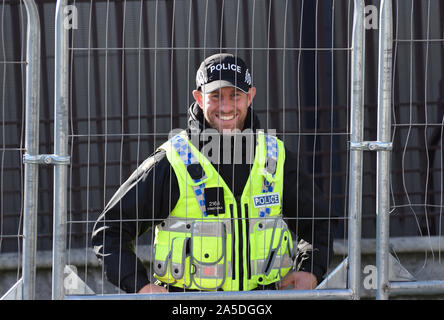 Friendly and Brave Armed Police Officer in London guarding Government Buildings Stock Photo