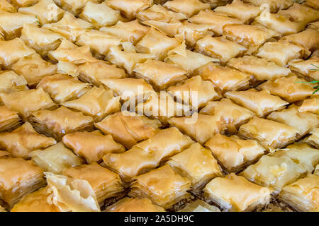 Honey soaked Baklava prepared with phyllo pastry, crunchy pistachio and drizzled with honey. Ready to be served and devoured Stock Photo