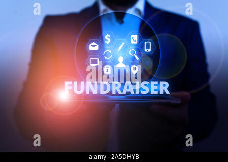 Text sign showing Fundraiser. Business photo showcasing demonstrating whose job or task is seek financial support for charity Stock Photo